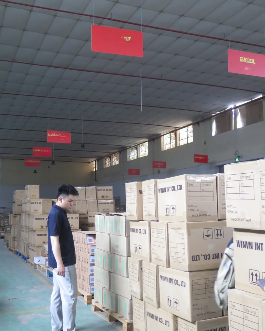 Labelled WINVN INT master cartons staged in the warehouse before an export loading